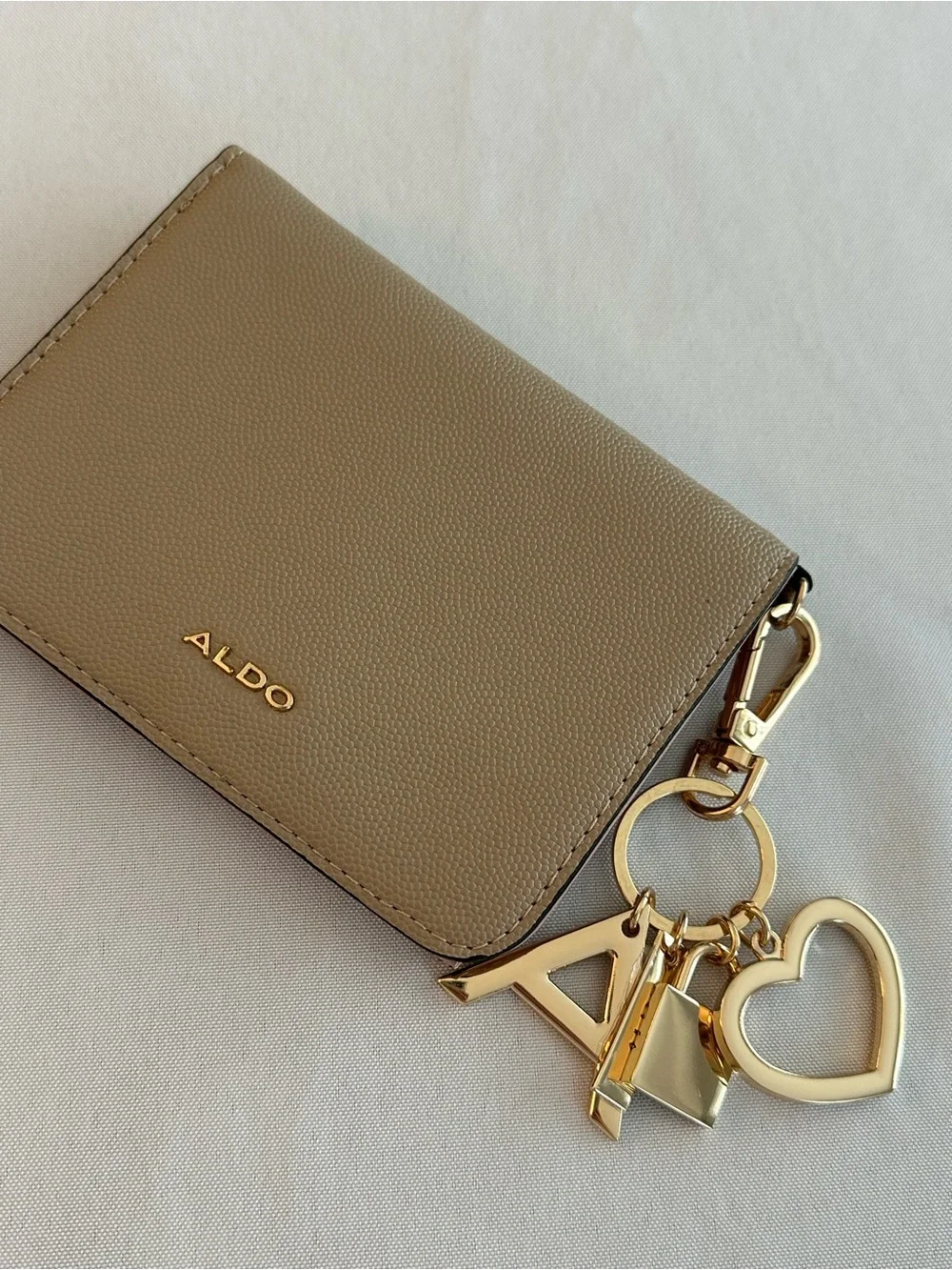 ALDO taupe card & charm key holder with gold accents